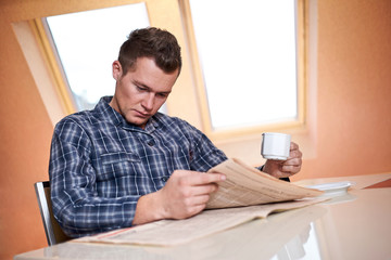Man reading newspaper