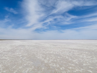 Fototapeta na wymiar White salt lake blue sky landscape