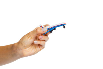 hand holding airplane toy model isolated on white background