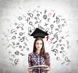 Girl with open book and education icons, concrete