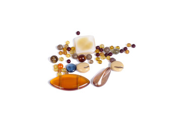 Pressed multicolored glass beads on white background - isolated
