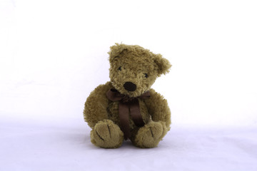 Brown teddy bear on white background.
