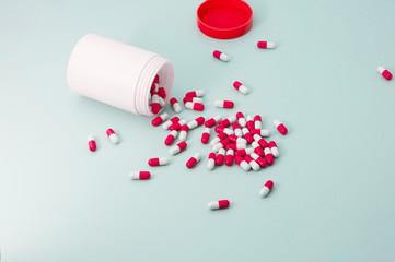 Heap of red color drugs or medical pills on floor