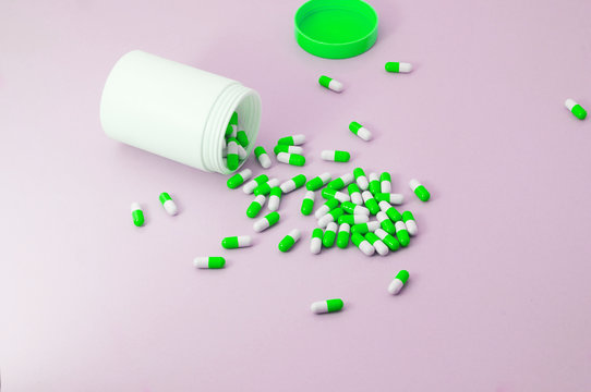Heap of green and white medical drug on floor