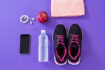 Sneakers, water bottle, towel, mobile phone 