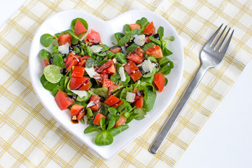 simple, fresh and delicious salad on heart shaped plate