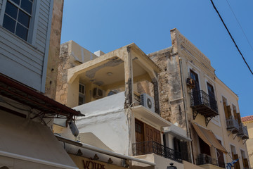 Fototapeta na wymiar Rethymno, Greece - August 3, 2016: Building in old town.