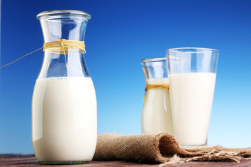 milk products - tasty healthy dairy products on a table on: and milk jar, glass bottle and in a glass