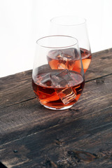 whiskey with ice on a wooden table