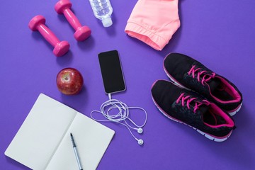 Fitness accessories with opened book, apple, 