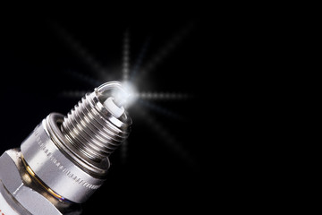  Spark plug for the car, on a black background