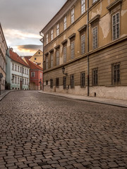 Fototapeta na wymiar Old cobble street in Prague Castle district