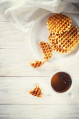 Cup of tea and waffle, top view. Copyspace