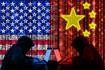 Amrican hacker sitting opposite of a chinese hacker cyberwar