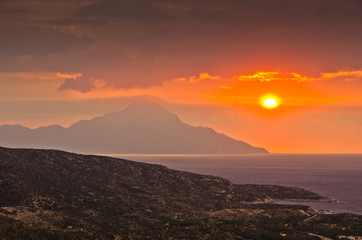 Stormy sky and sunrise at holy mountain Athos in Greece
