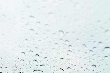 Abstract background with selective focus on glass with water drops