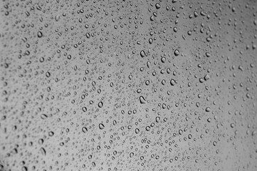 Close up to water drops on glass with selective focus