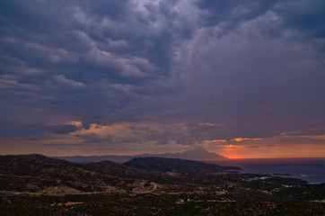 Stormy sky and sunrise at holy mountain Athos in Greece