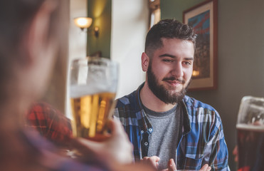 Group Of Hipster Friends Drinking Craft Beer focus on Hipster