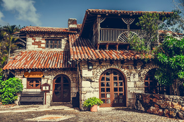 Fototapeta na wymiar Retro processed image. Filtered hipster style photo of ancient style village building. Altos de Chavon, Dominican Republic.