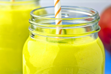 Mango and lime smoothie in jars 