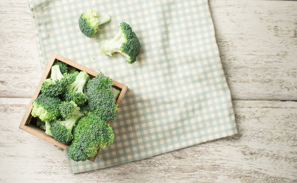 Fresh green broccoli on wooden background,top view