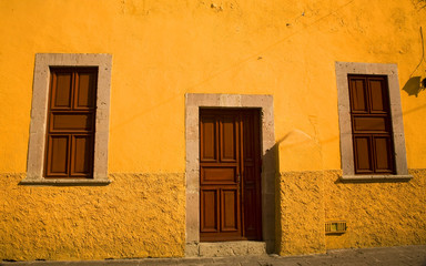 Yellow Adobe House Brown Doors Morelia Mexico