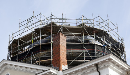 Scaffolding surrounding dome restoration on rural courthouse.
