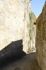 Narow stone alley in Tui, Galicia, Spain