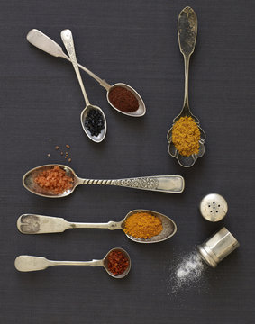 Spices in antique spoons overhead.