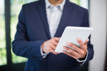 Businessman using digital tablet in a restaurant