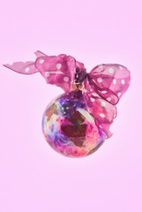 Christmas Ornament With a Pink Bow and Background