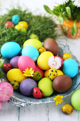 Fototapeta na wymiar Multicolored Easter eggs with flowers
