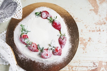 beautiful cake with strawberries and cream