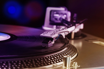 Turntable player with musical vinyl record. Useful for DJ, nightclub and retro theme. Light leak...