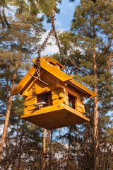Birdhouse in the woods. Food for small birds.