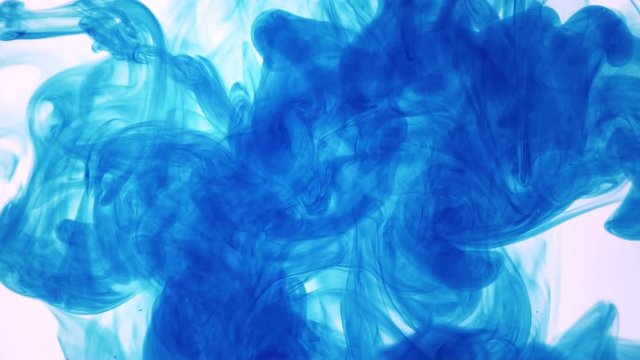 ink poured into water slow motion