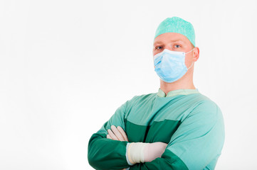 Fototapeta na wymiar Portrait of a proud surgeon with mask on white background