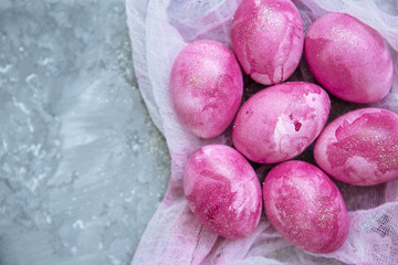 Colorful decorated easter eggs on gray plaster background. Happy Easter