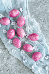 Colorful decorated easter eggs on gray plaster background. Happy Easter