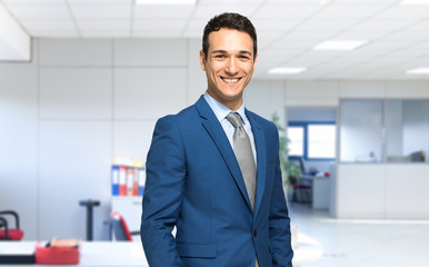 Fototapeta premium Smiling businessman in his office