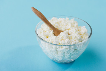 Fresh cottage cheese in a glass bowl
