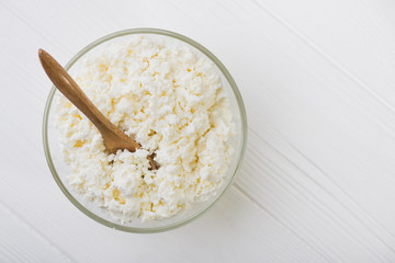 Fresh cottage cheese in a glass bowl