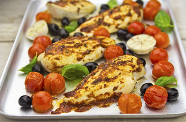 Harissa chicken with olives, tomatoes and garlic 