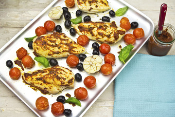 Harissa chicken with olives, tomatoes and garlic 