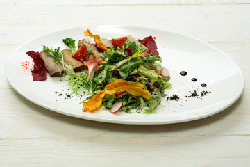Green salad with baked meat