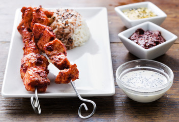 Chicken tandoori skewers with sauces