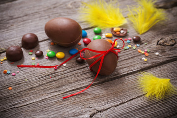 Chocolate Easter Eggs Over Wooden Background