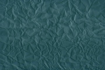 Dark green wrinkled paper background