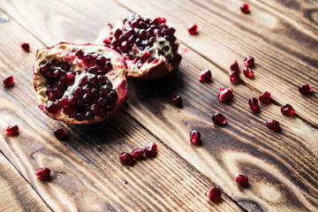 garnet grains, grenades wooden background